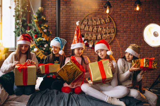 Group of kids sitting sitting with presents