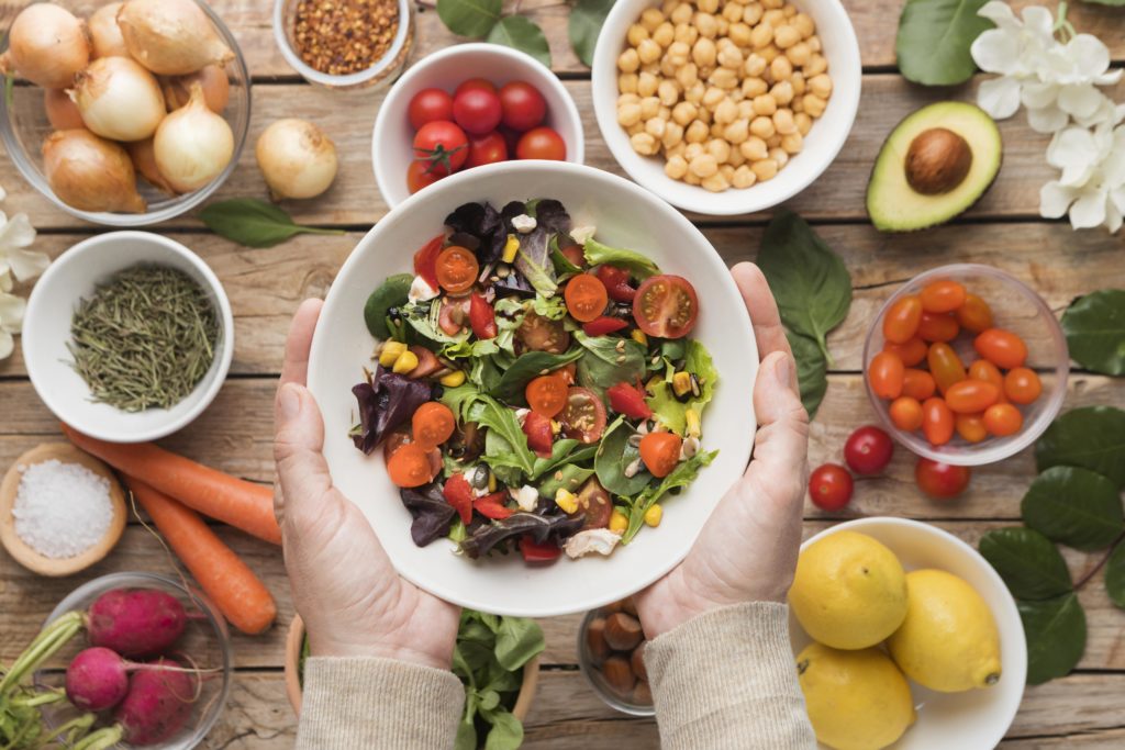 Top view ingredients and veggies in salad